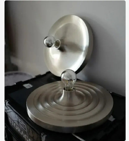 Silver-toned circular lamp base with concentric ridges and central bulb holder for decorbites bauhaus lamp