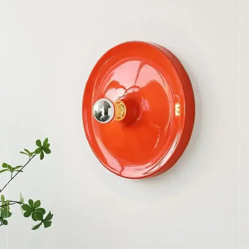 Vibrant orange ceramic bauhaus lamp with polished metallic knob and brass accent by decorbites bauhaus