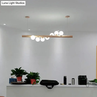 Decorbites minimalist cream glass pendant light with wooden bar and spherical bulbs for restaurants ball island pendant