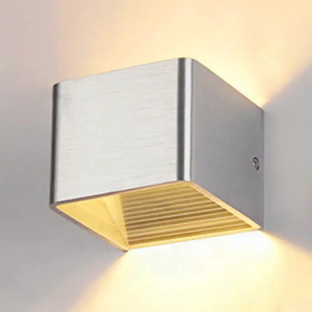 Modern brushed silver sconce light with warm yellow diffuser and horizontal slats for decorbites minimalist cube shade use