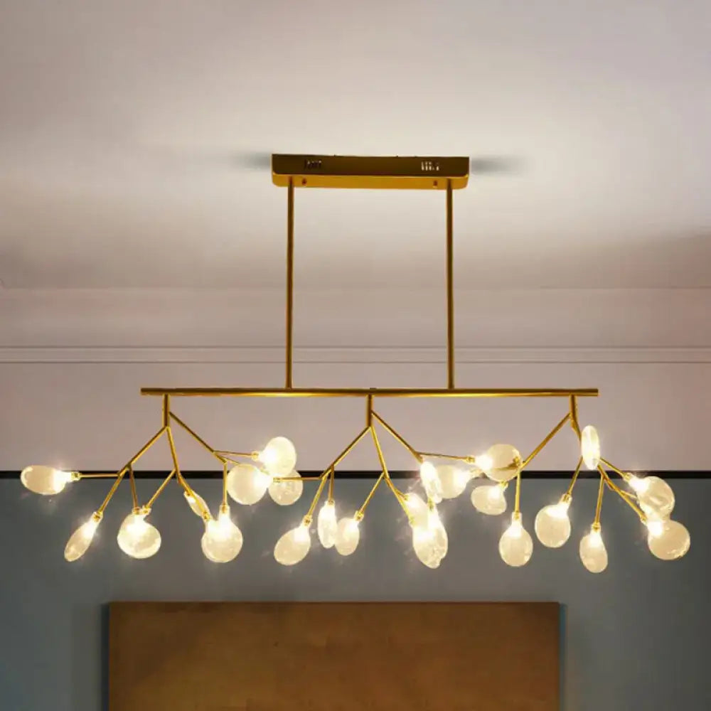 Gold-toned modern ceiling light fixture with acrylic frosted glass globes perfect for dining room fixture width display