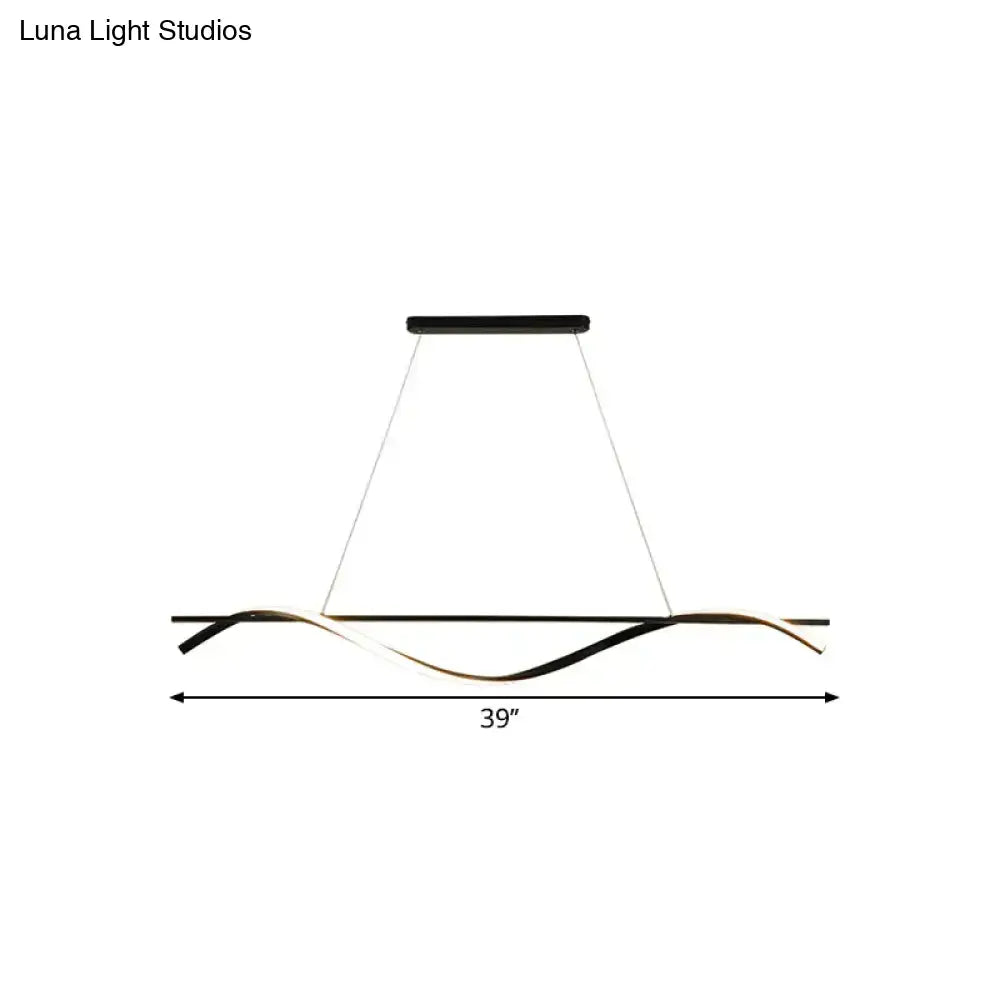 Modern black and gold led hanging island light with a sleek wave-like design for dining room by decorbites