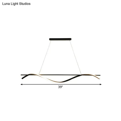 Modern black and gold led hanging island light with a sleek wave-like design for dining room by decorbites