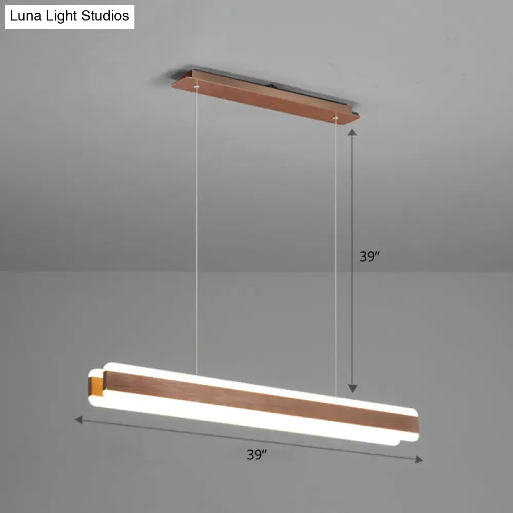A modern decorbites minimalist led island pendant with warm copper finish and two glowing white led acrylic hanging light strips