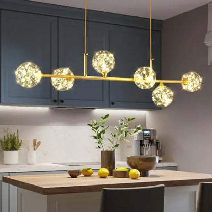 DecorBites minimalist LED pendant ceiling light with brass finish and clear glass sphere shade featuring five glowing globes