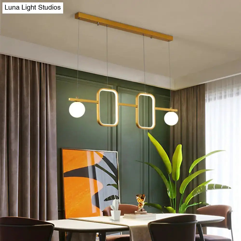 Modern gold-toned DecorBites™ pendant light with symmetrical geometric LED design and remote control stepless feature