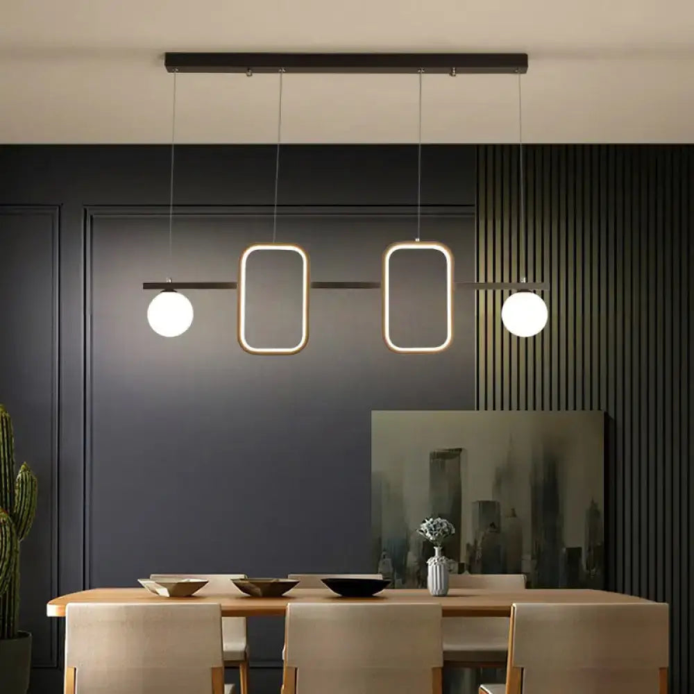 Modern black rectangular pendant light with symmetrical geometric led design, cream glass shade, and remote control stepless feature