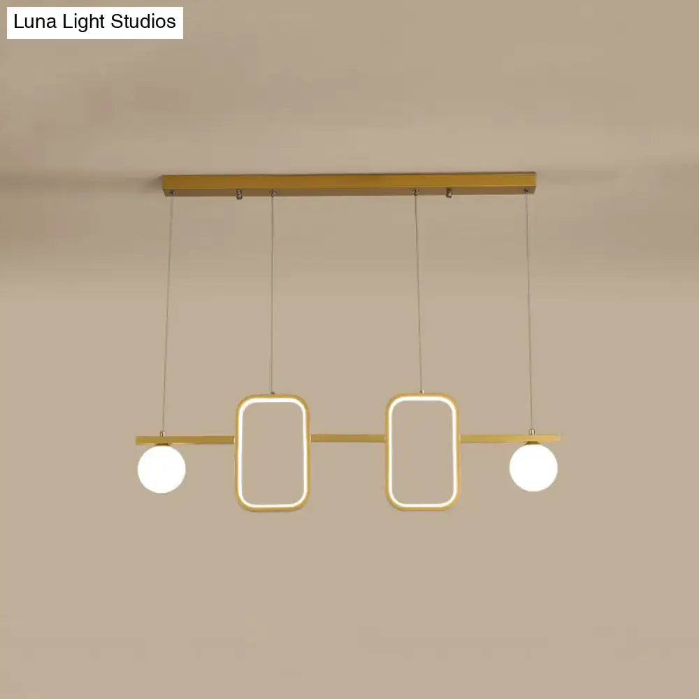 Modern gold-toned DecorBites™ minimalist metal pendant light with symmetrical geometric LED and cream glass shade with color remote control