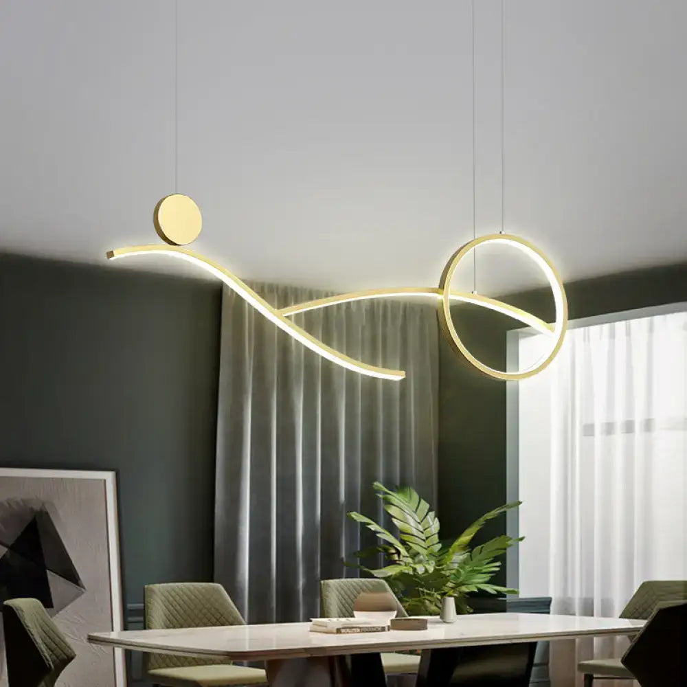 Modern gold-toned minimalist metal led hanging light with curved lines for dining room and kitchen island by DecorBites