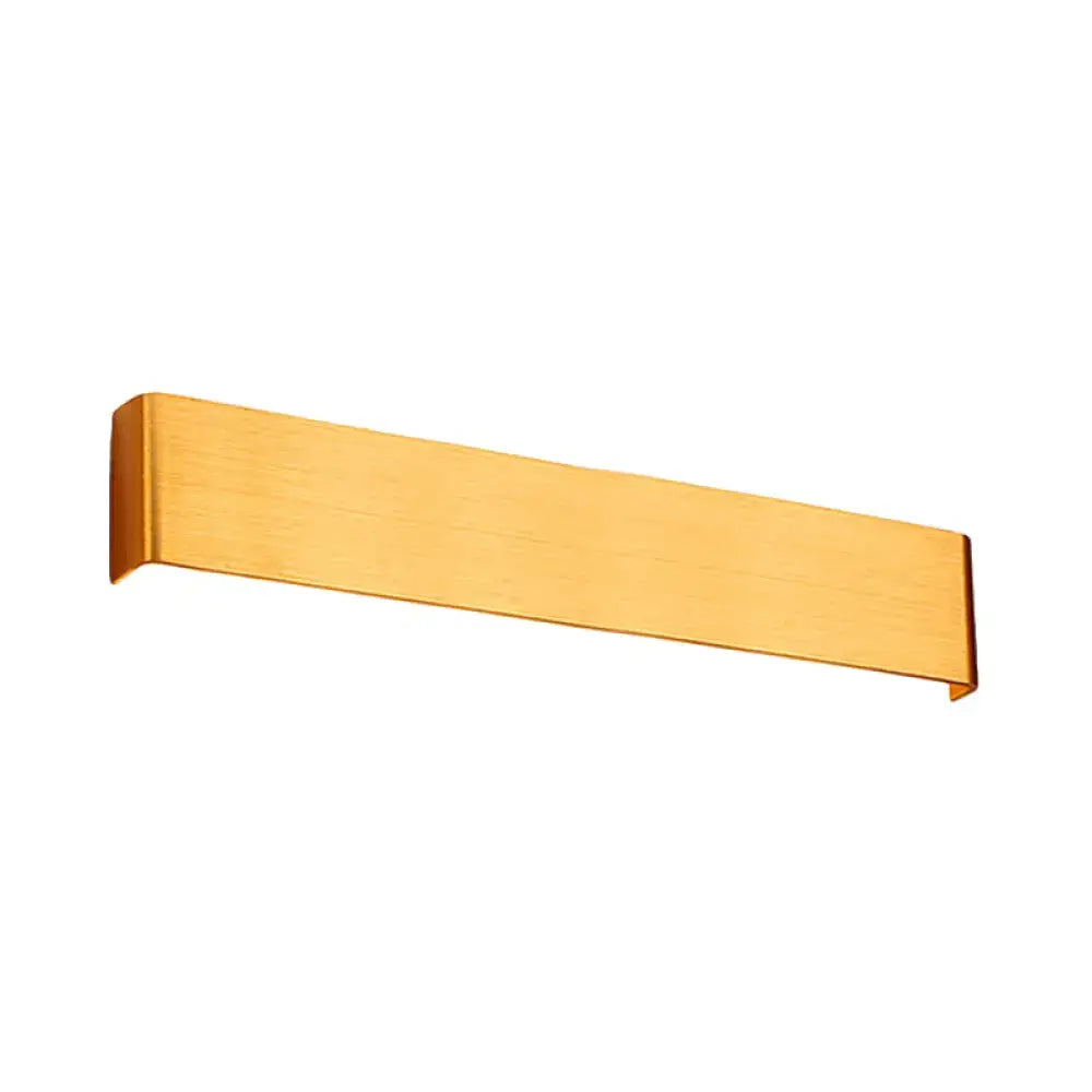 Gold-colored brushed metal towel rack with sleek rectangular design complements minimalist black and silver wall lamp for living room warm white light