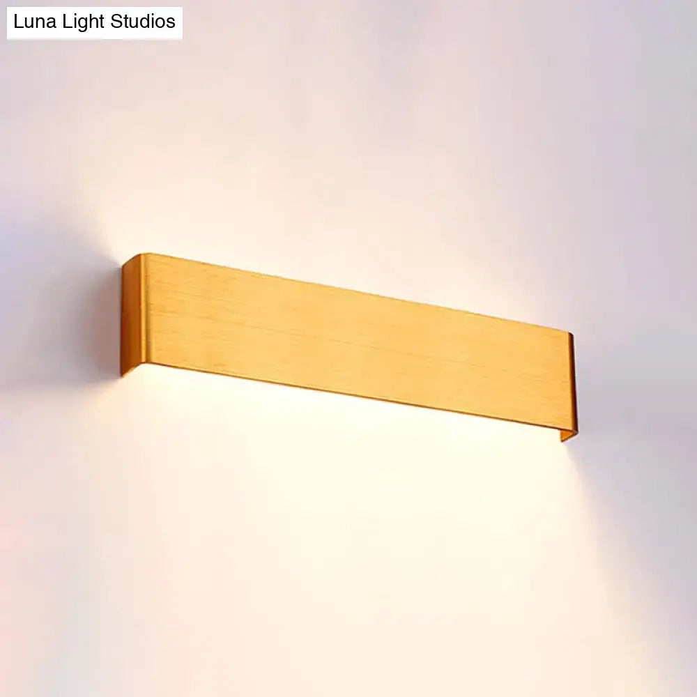 Gold-finished rectangular wall lamp with minimalist design for living room warm white lighting