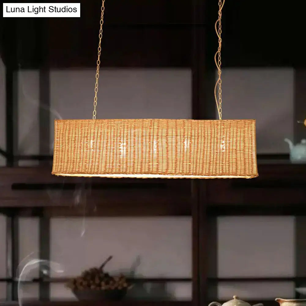 Decorbites minimalist rectangular woven rattan restaurant hanging lamp with 3 heads and warm golden glow