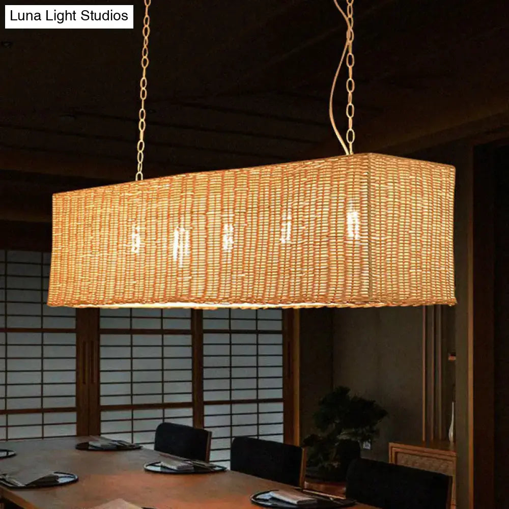 Decorbites minimalist rectangular woven rattan restaurant hanging lamp with warm golden glow and three heads