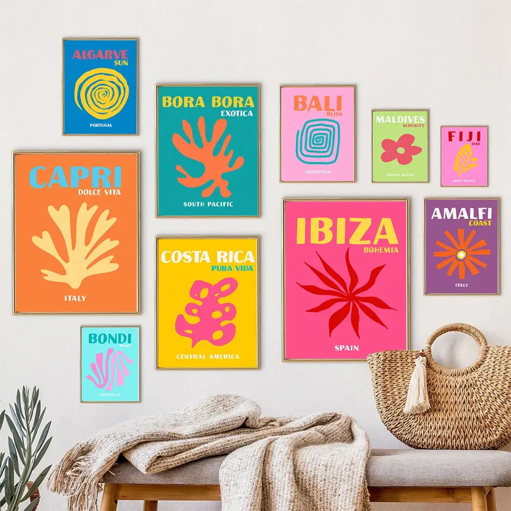 A woven straw tote bag with a tassel handle featured alongside DecorBites™ minimalist travel posters art prints
