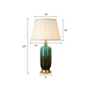 Elegant white tapered table lamp with green gradient ombre ceramic base cream pleated shade and gold-toned accents