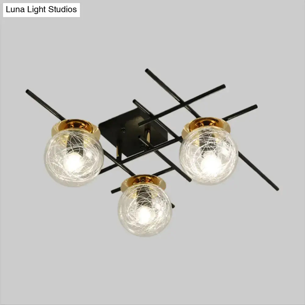 Black metal DecorBites™ ceiling light with three crackled glass globe shades in clear smoke gray and gold rims for bedroom use