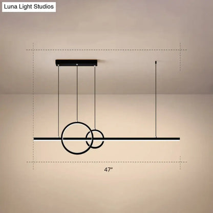 Modern black minimalist acrylic ceiling light with intersecting rings and horizontal bar for dining room by luna light studios