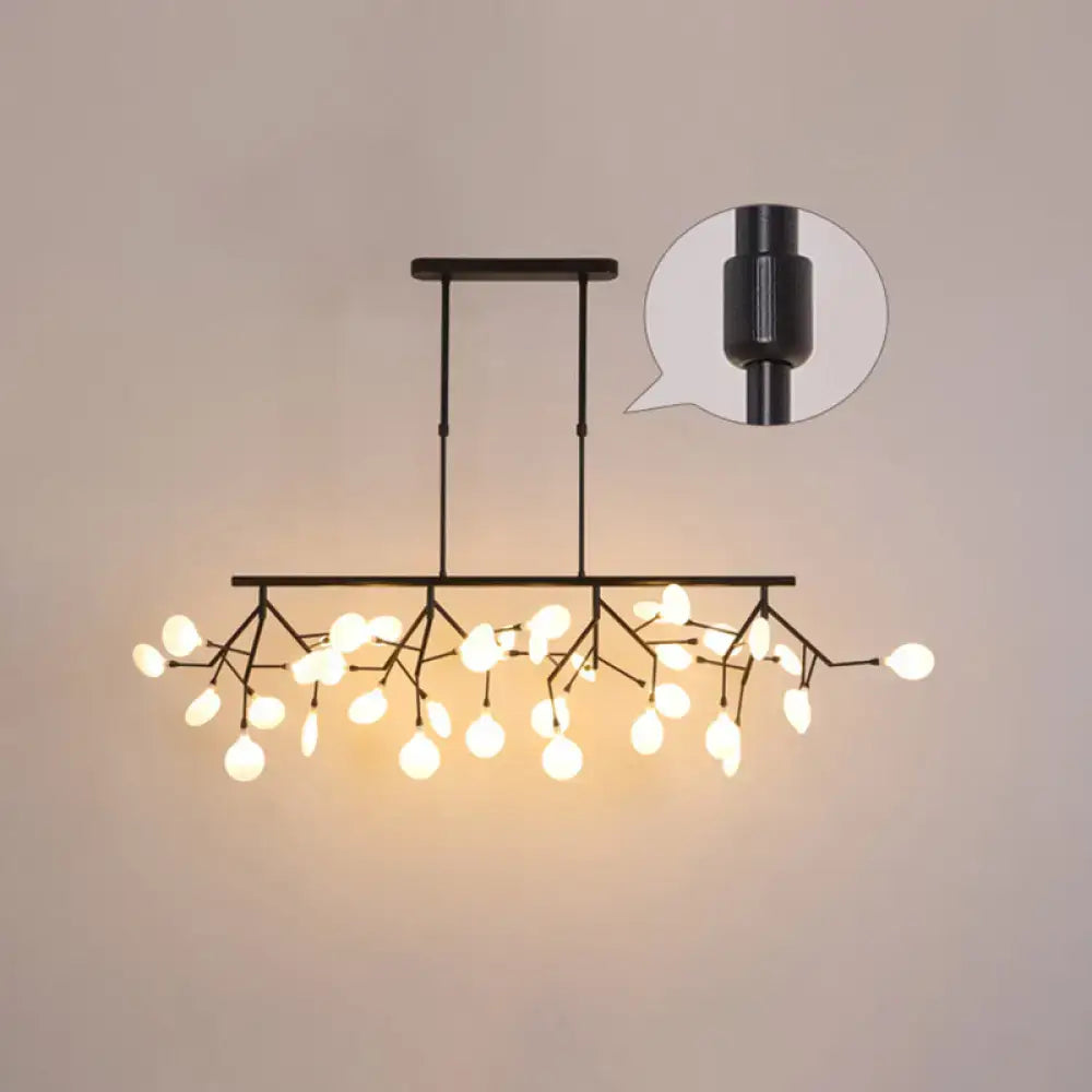 Black metal ceiling pendant with acrylic twig design and warm white globe bulbs for dining room lighting