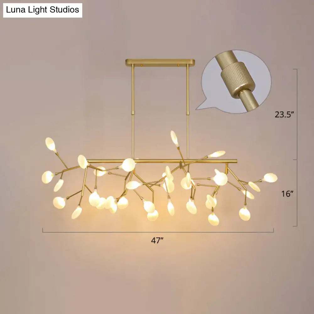 Gold-toned acrylic twig ceiling pendant with frosted glass leaf lights for minimalistic dining room decorBites dining room