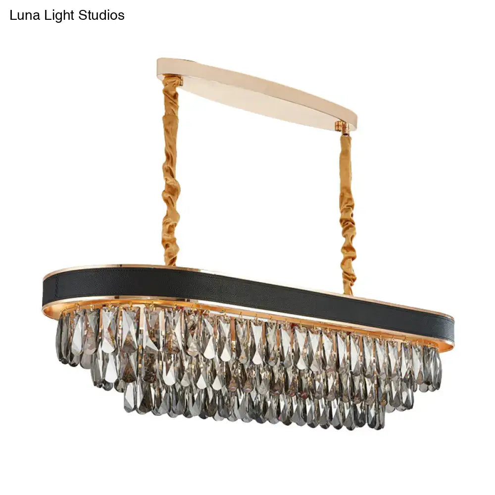 Elegant oval beveled crystal island pendant with black leather band gold twisted chains and cascading clear crystals for dining room