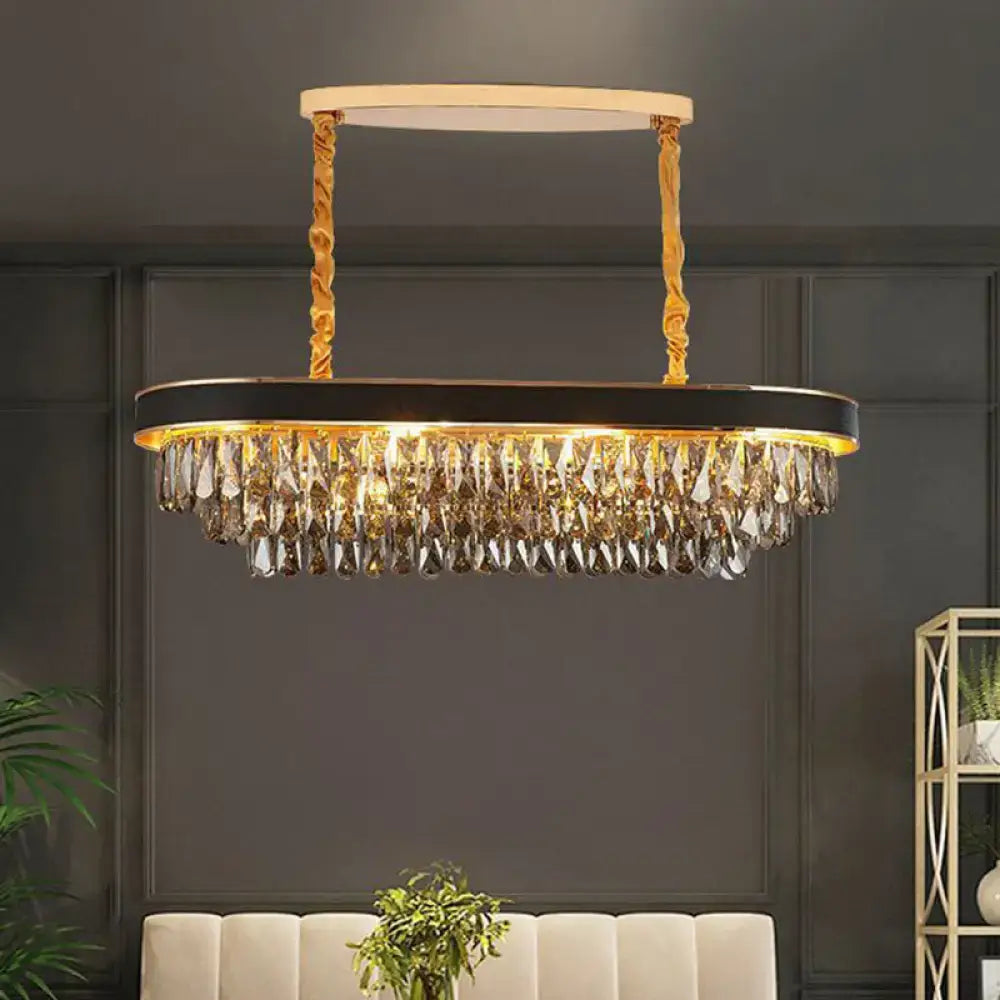 Gold-toned oval decorbites™ modern 10-light beveled crystal island pendant with black frame and cascading crystal droplets