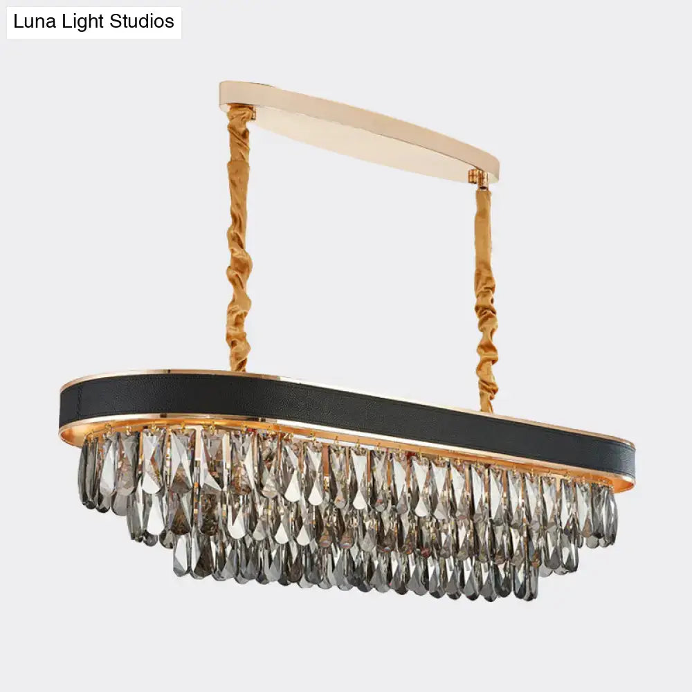 Elegant black and gold DecorBites™ modern 10-light beveled crystal island pendant with leather band and gray crystal teardrops
