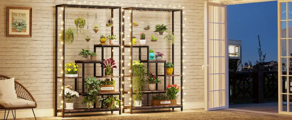 DecorBites™ modern 5-tier tall black metal plant stand with string lights displaying assorted potted plants on metal plant shelf