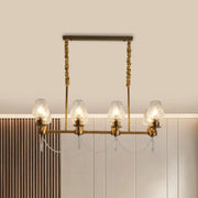 Brass-finished ceiling light DecorBites™ modern 8-light pendant with frosted glass shades and crystal teardrops