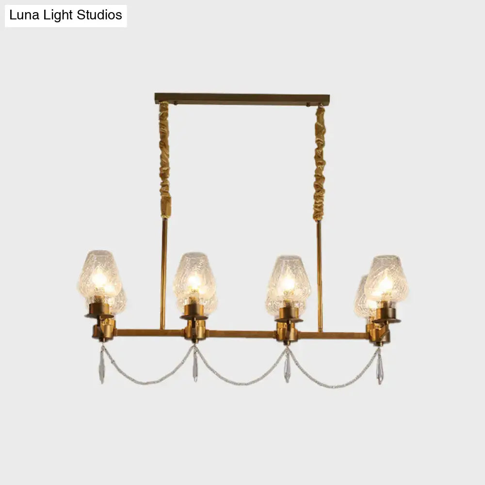 Decorbites modern ceiling light with brass finish, five textured glass shades, and dangling crystal pendants