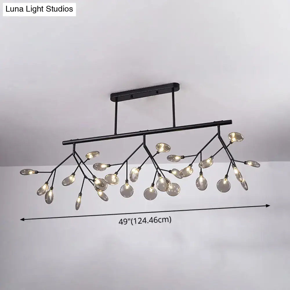 Black metal firefly island pendant chandelier with branching arms and clear glass globe bulbs for dining room lighting