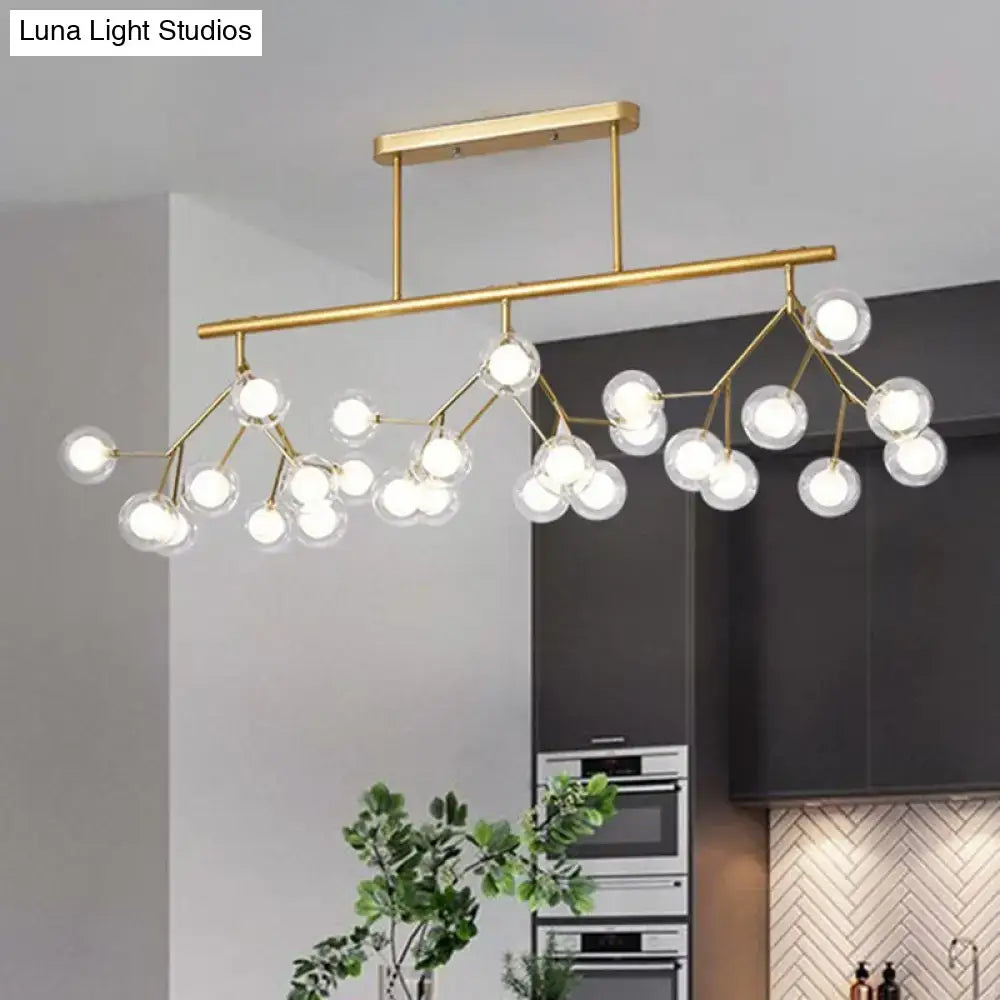 Gold-toned DecorBites™ modern acrylic firefly island pendant ceiling light with clear glass globe bulbs in branching design