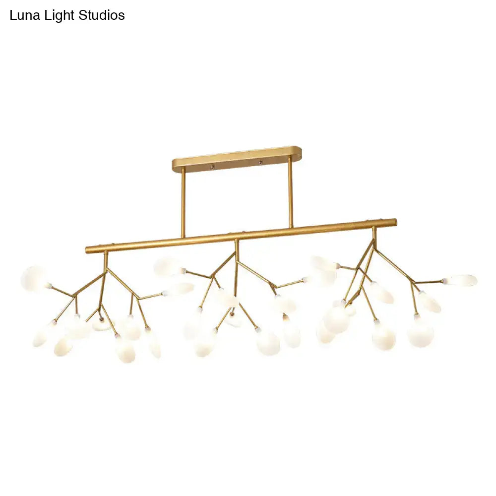 Gold-toned modern firefly island pendant with branching metal arms and frosted glass globe shades for dining room