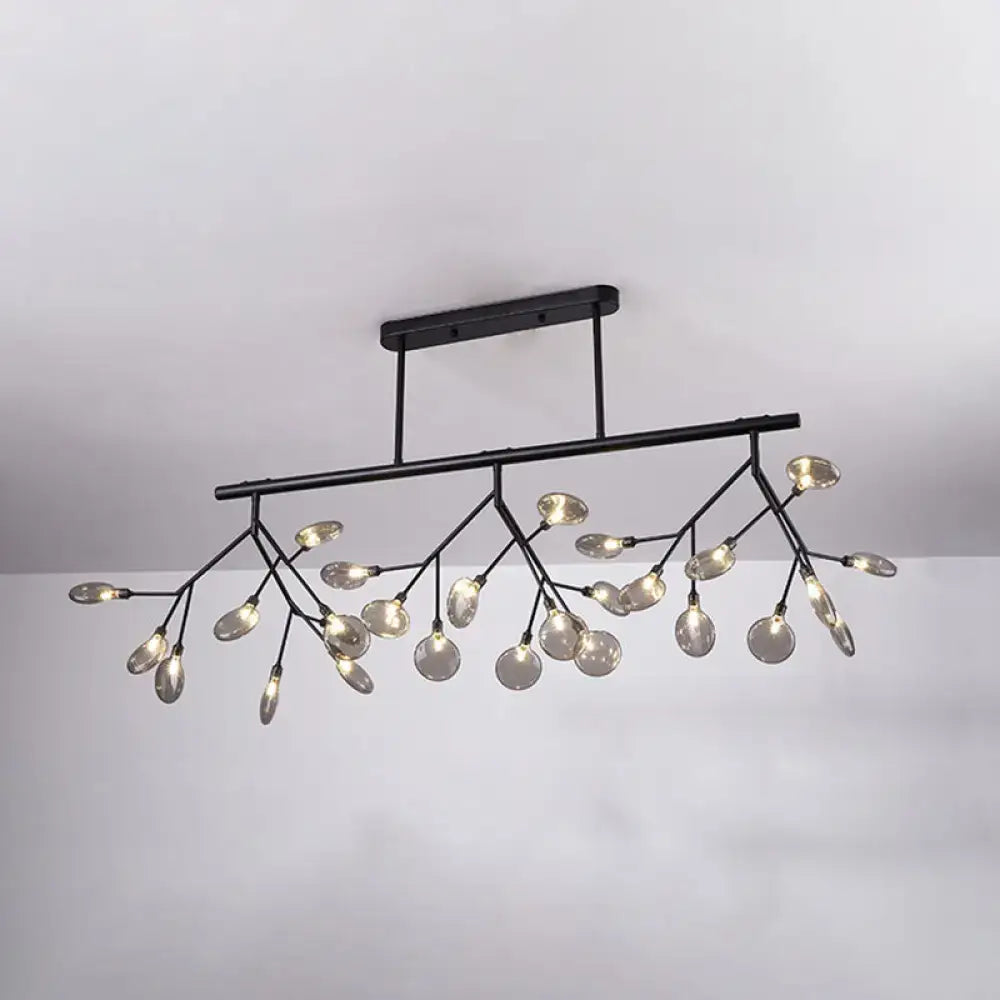Black metal firefly island pendant chandelier with branching arms and clear glass globe bulbs for dining room lighting