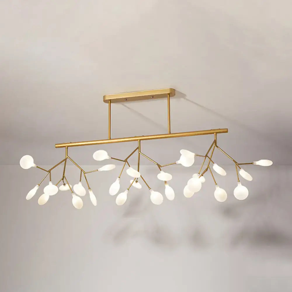 Gold-toned modern firefly island pendant with frosted glass globes and branching arms for dining room lighting