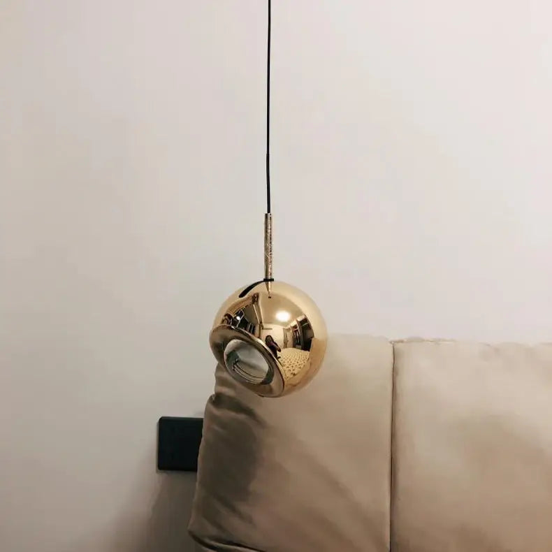 DecorBites™ modern adjustable led pendant light with a sleek spherical gold metallic finish hanging from black cord