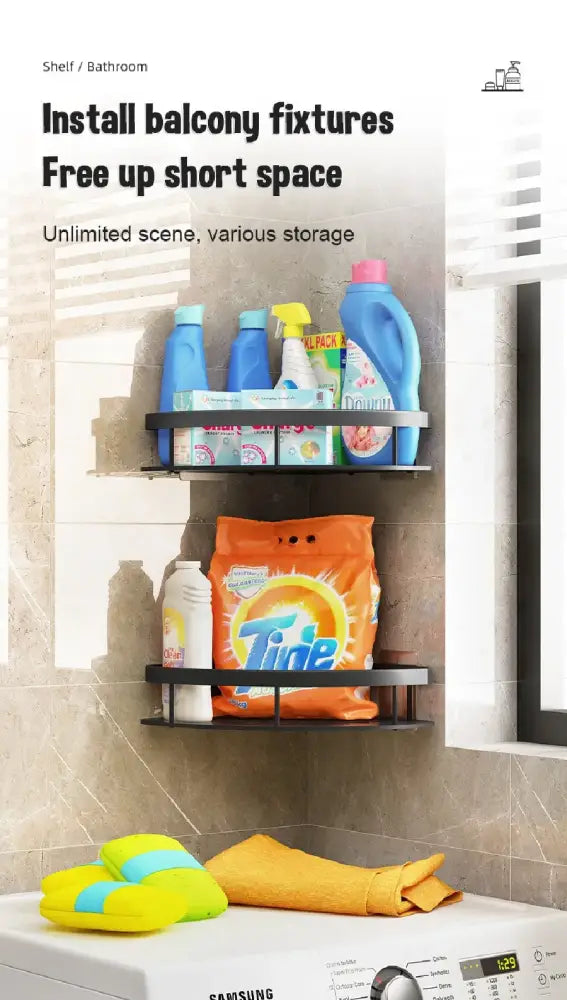 Black metal two-tier aluminum bathroom corner caddy shelf with curved edges holding laundry supplies and tide bag