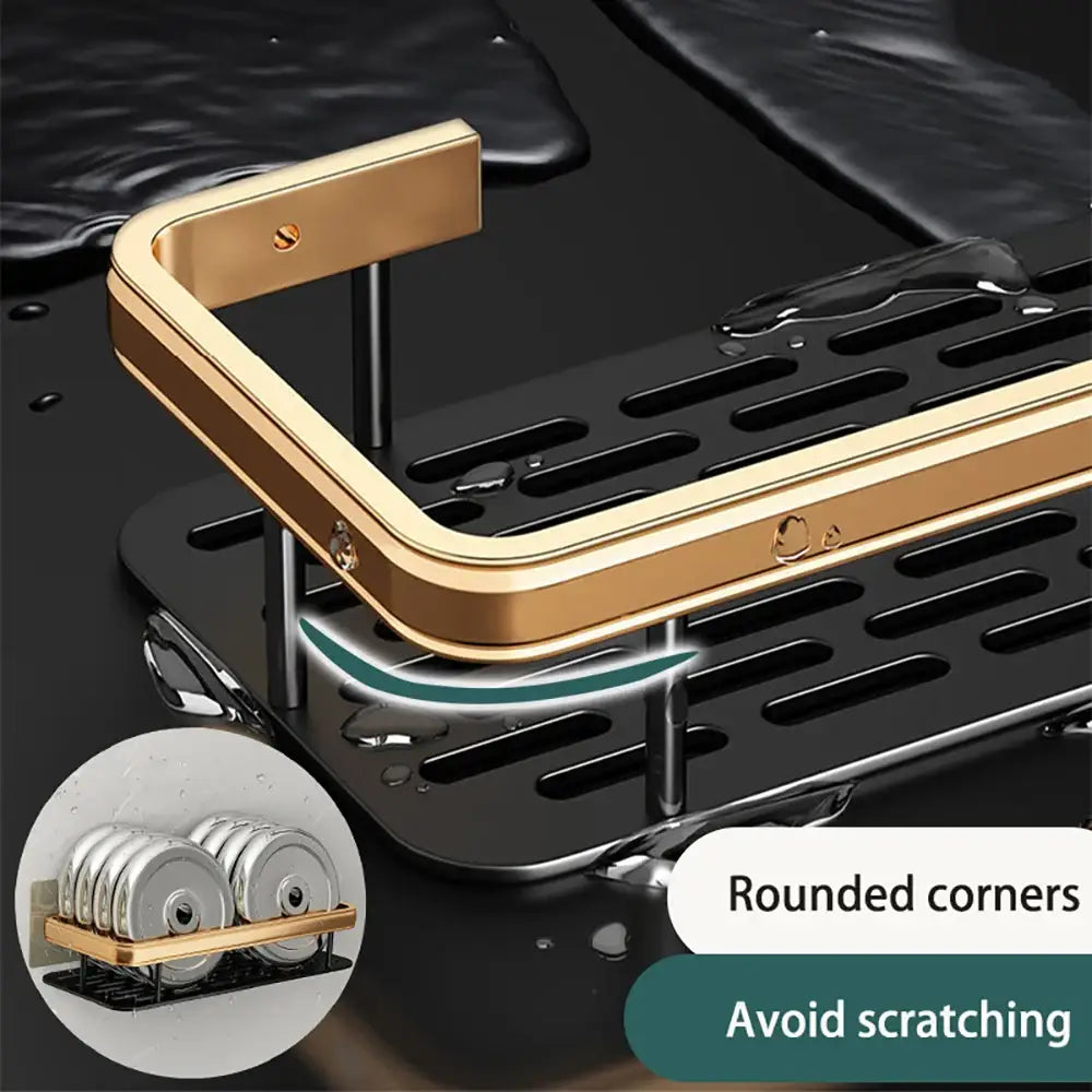 Gold-toned DecorBites™ Modern aluminum bathroom corner caddy with black perforated drainage base and sleek rounded design