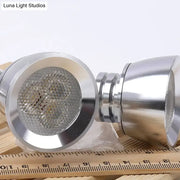 Modern chrome led wall light with adjustable arm featuring a shiny chrome-finished led showerhead and circular led array