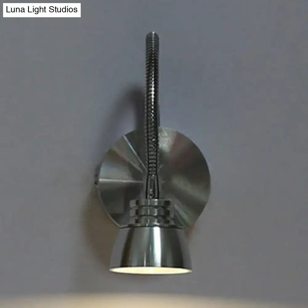A sleek chrome wall light with an adjustable arm and spiral neck by decorbites modern aluminum for bedroom decor