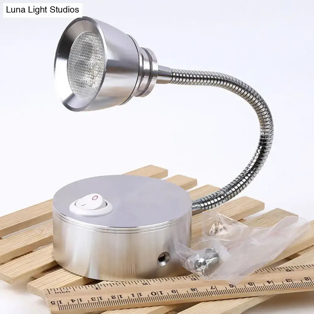 Silver metallic desk lamp with flexible gooseneck and circular base featuring power switch for decorbites modern aluminum wall light
