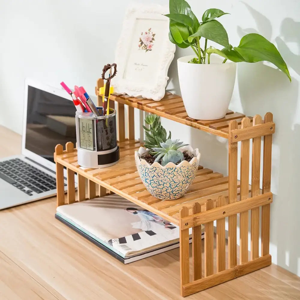 Light brown bamboo two-tier plant display stand with picket fence design from decorbites modern collection