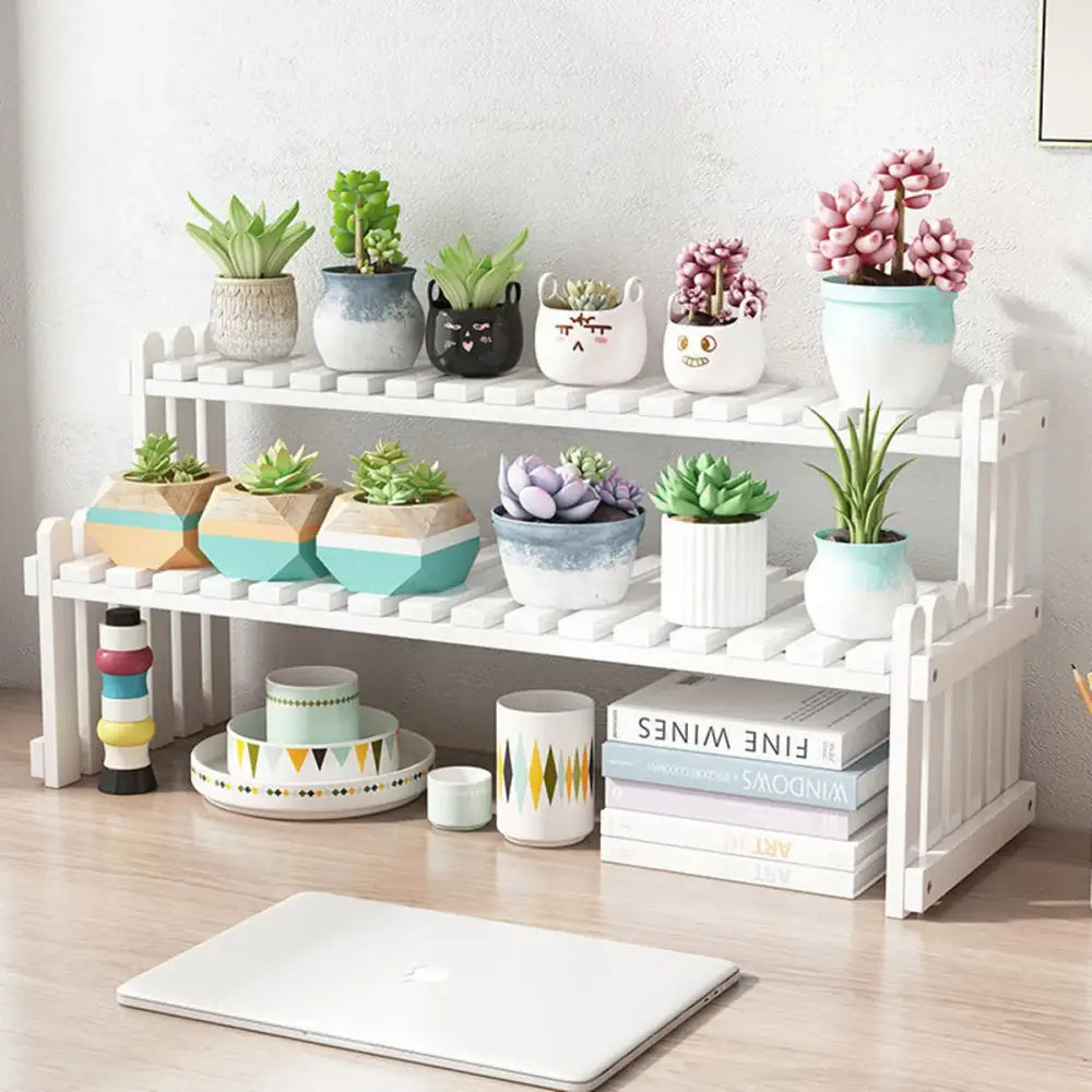 White modern bamboo two-tier plant display stand with decorative slats and picket-style edges for plant display use