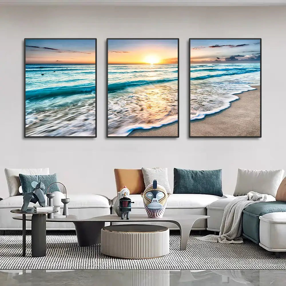 Set of three framed modern beach sunset canvas panels featuring vibrant orange and purple hues for wall decoration