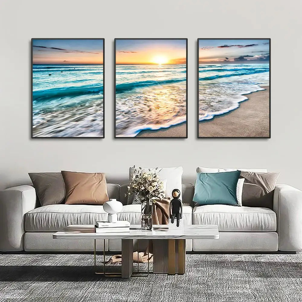 DecorBites modern three-panel beach sunset canvas set with black frames featuring turquoise waves and golden sunset hues