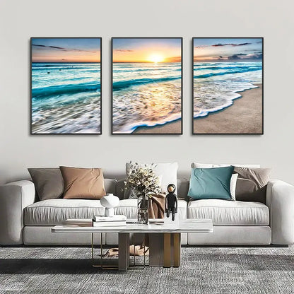 DecorBites modern three-panel beach sunset canvas wall art set with black frames featuring turquoise waves and golden sunset