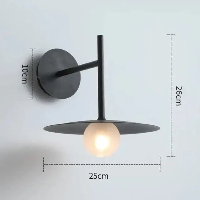 DecorBites modern bedside wall light in black matte finish with circular base and frosted glass bulb wall sconce