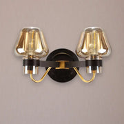 Modern black and gold two-light fixture with amber glass mushroom sconce light ideal for living room decor