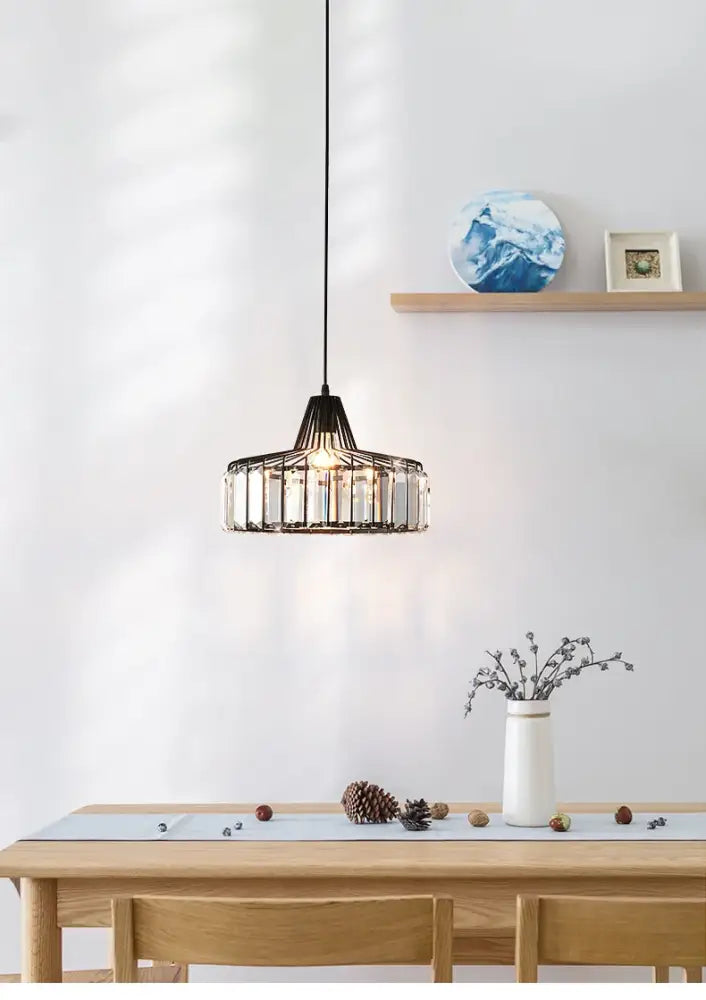 DecorBites™ modern black crystal led pendant lamp with black metal frame and clear crystal glass panels above dining table