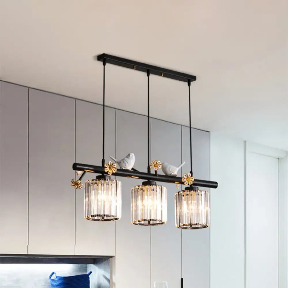 DecorBites™ modern black cylinder island light pendant features three crystal glass shades with white bird accents