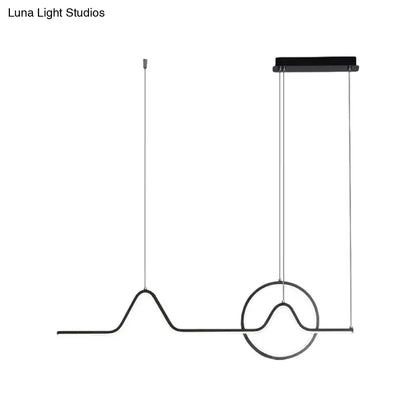 Black minimalist pendant ceiling light with wave-like wire design and circular accent providing warm white light